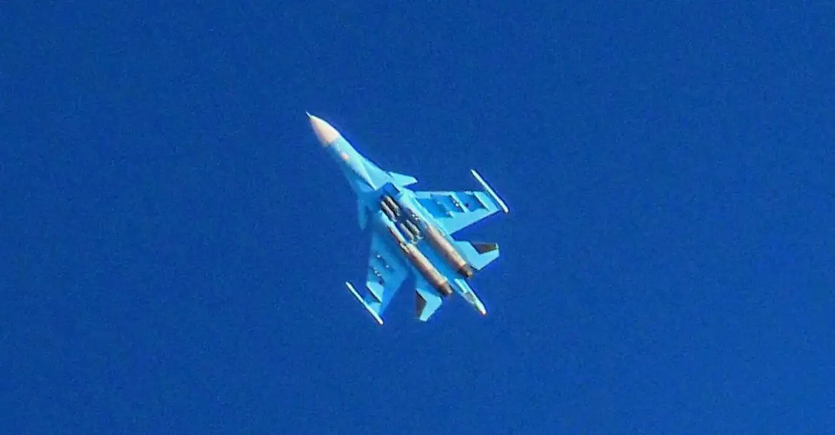 A Russian Air Force Sukhoi Su-34 flies over the city of Binnish in the eastern part of the Idlib province in northwestern Syria