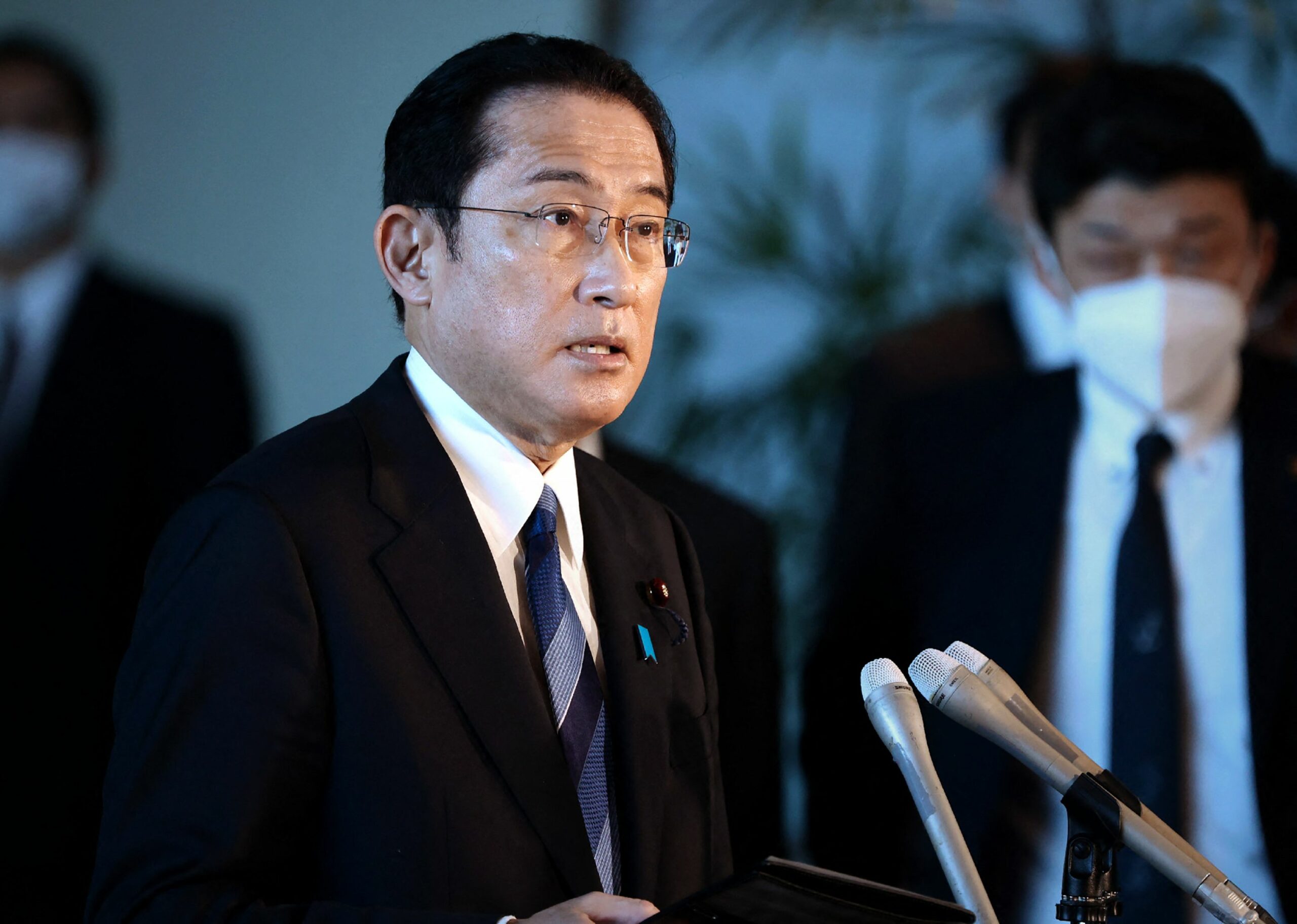 Japan's Prime Minister Fumio Kishida speaks to reporters