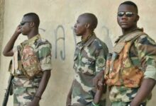 Malian Defense Forces soldiers look on in Timbuktu