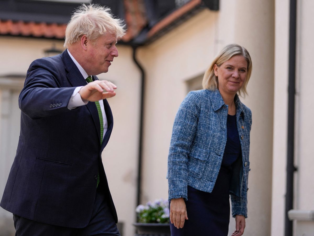 Boris Johnson is greeted by Magdalena Andersson