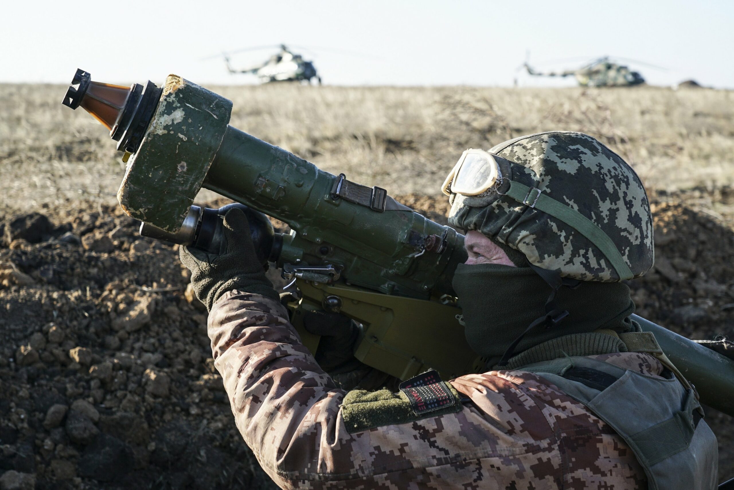 A Ukrainian soldier aims with an anti-aircraft launcher