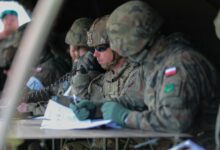 US Army major communicating during DEFENDER 2022 exercise in Poland