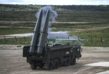 Russian officials give a presentation of the Iskander M missile