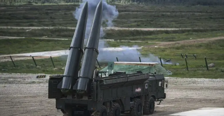 Russian officials give a presentation of the Iskander M missile