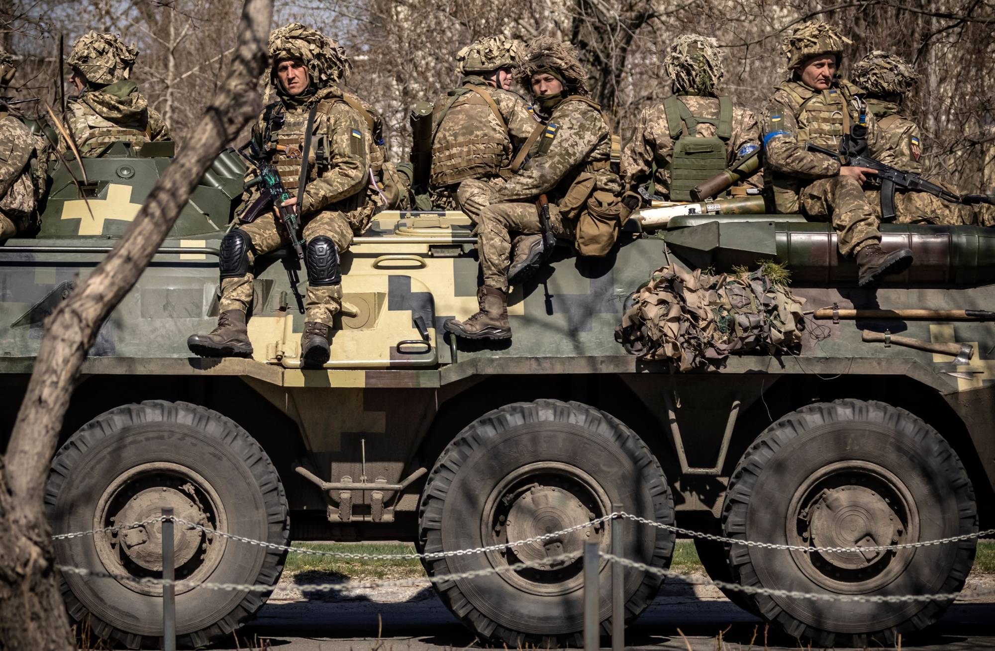 Ukrainian soldiers on top of an armored vehicle