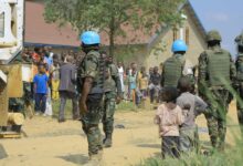 Peacekeeping forces stand guard outside the Butsili Catholic Church in Beni, DR Congo