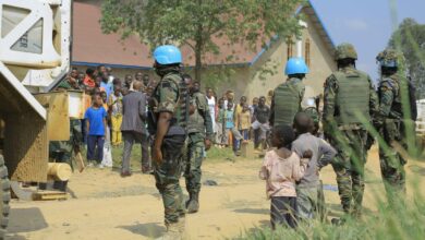 Peacekeeping forces stand guard outside the Butsili Catholic Church in Beni, DR Congo