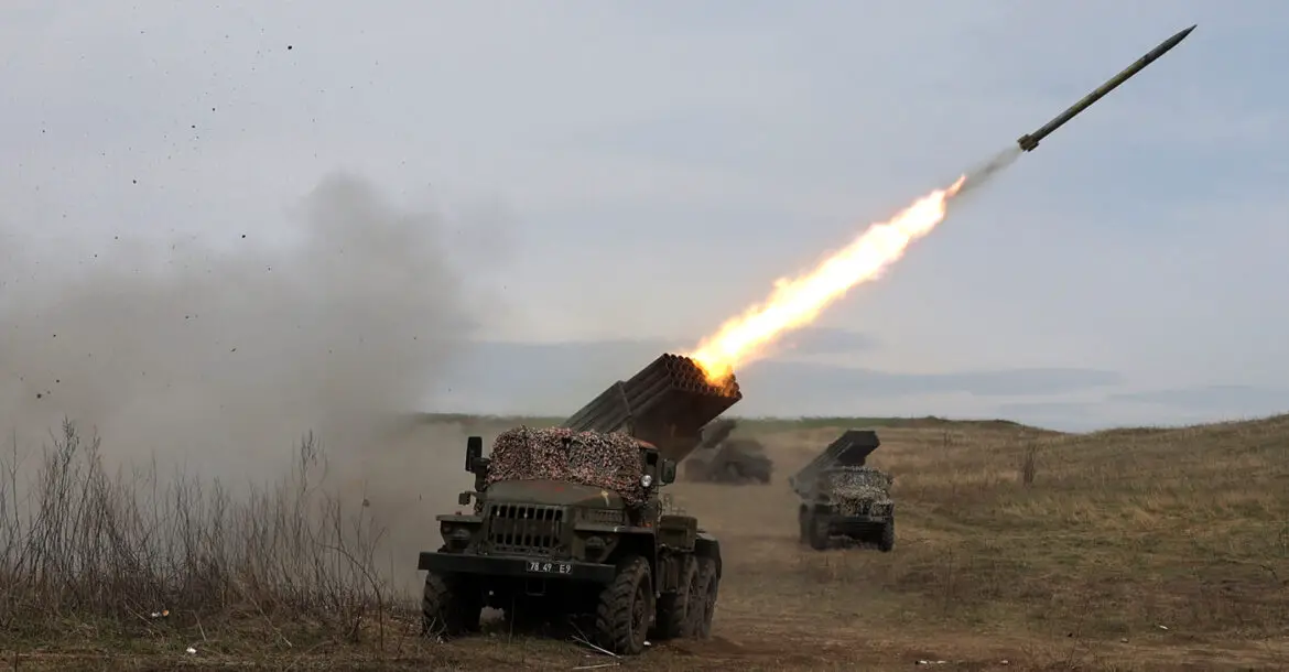 A Ukrainian multiple rocket launcher BM-21 "Grad" shells Russian troops' position