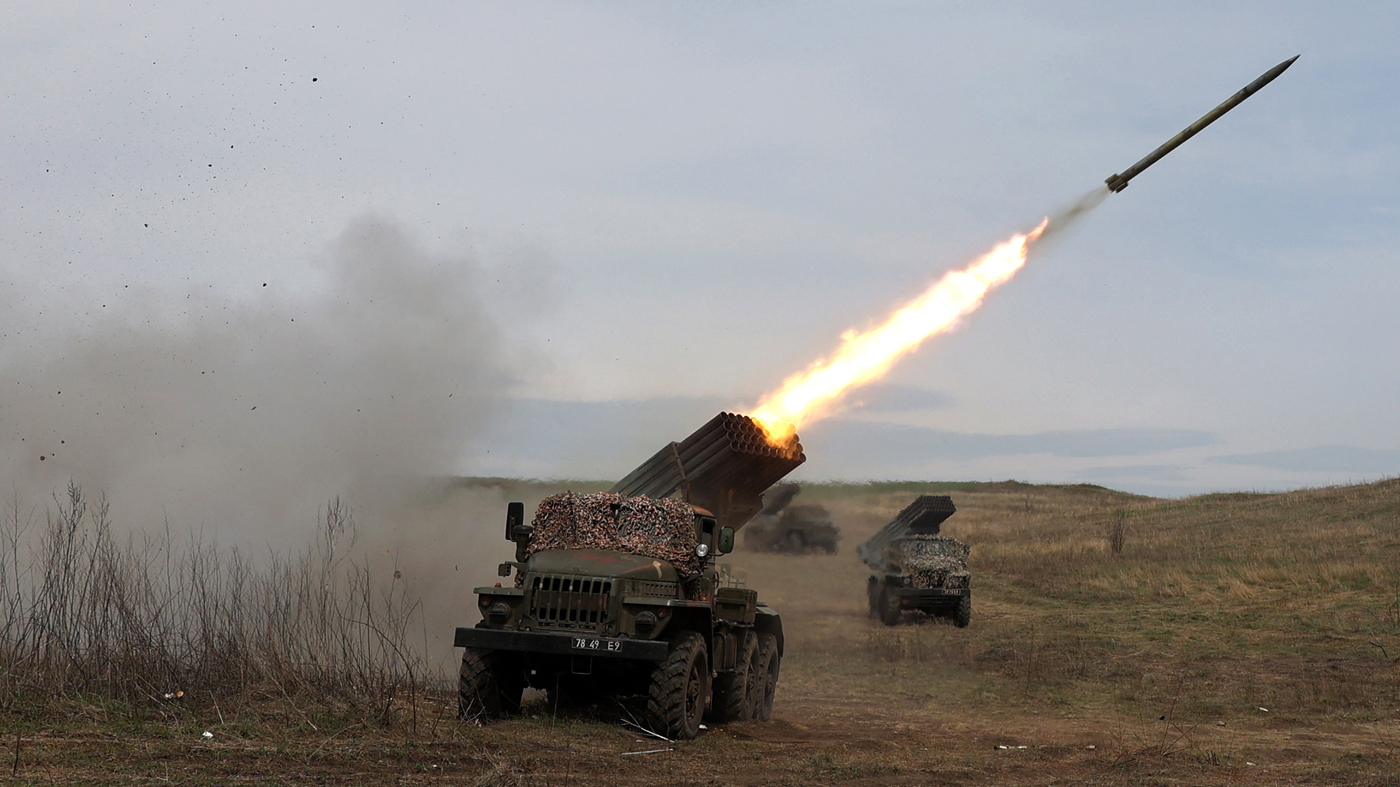 A Ukrainian multiple rocket launcher BM-21 "Grad" shells Russian troops' position
