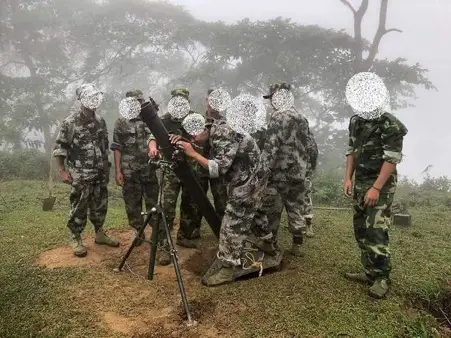 Myanmar resistance movement members preparing to deploy a mortar