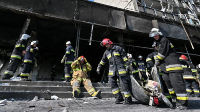 Firefighters remove rubble following a Russian airstrike in the central city of Vinnytsia