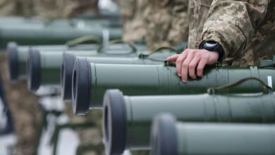 Ukrainian servicemen taking part in the armed conflict with Russia-backed separatists in Donetsk region of the country attend the handover ceremony of military heavy weapons and equipment in Kyiv