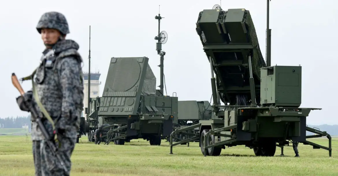 Soldiers from the Japan Air Self-Defense Force set up PAC-3 surface-to-air missile launch systems