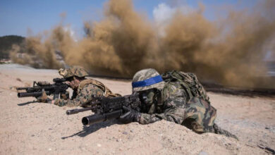 South Korean and US soldiers take a position during an annual joint military landing exercise in Pohang, on South Korea's southeast coast, on March 12, 2016