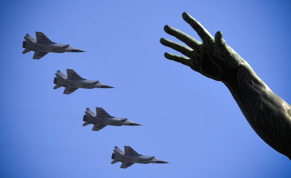 Russian MiG-31BM fighters fly over Red Square in Moscow