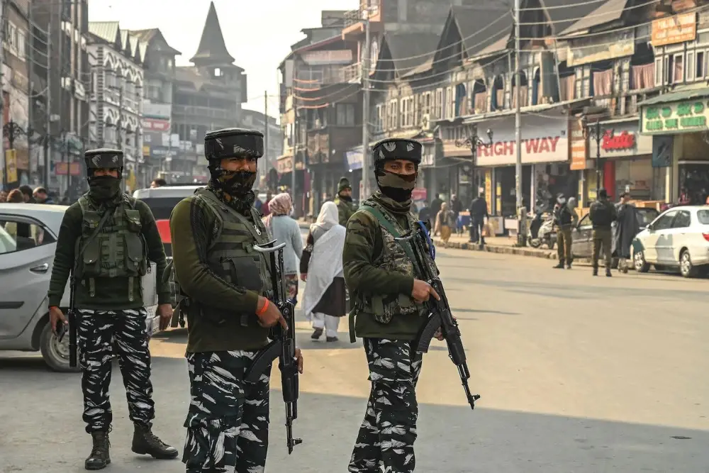 Indian paramilitary troopers stand guard during a random search along a street in Srinagar, Indian-administered Kashmir