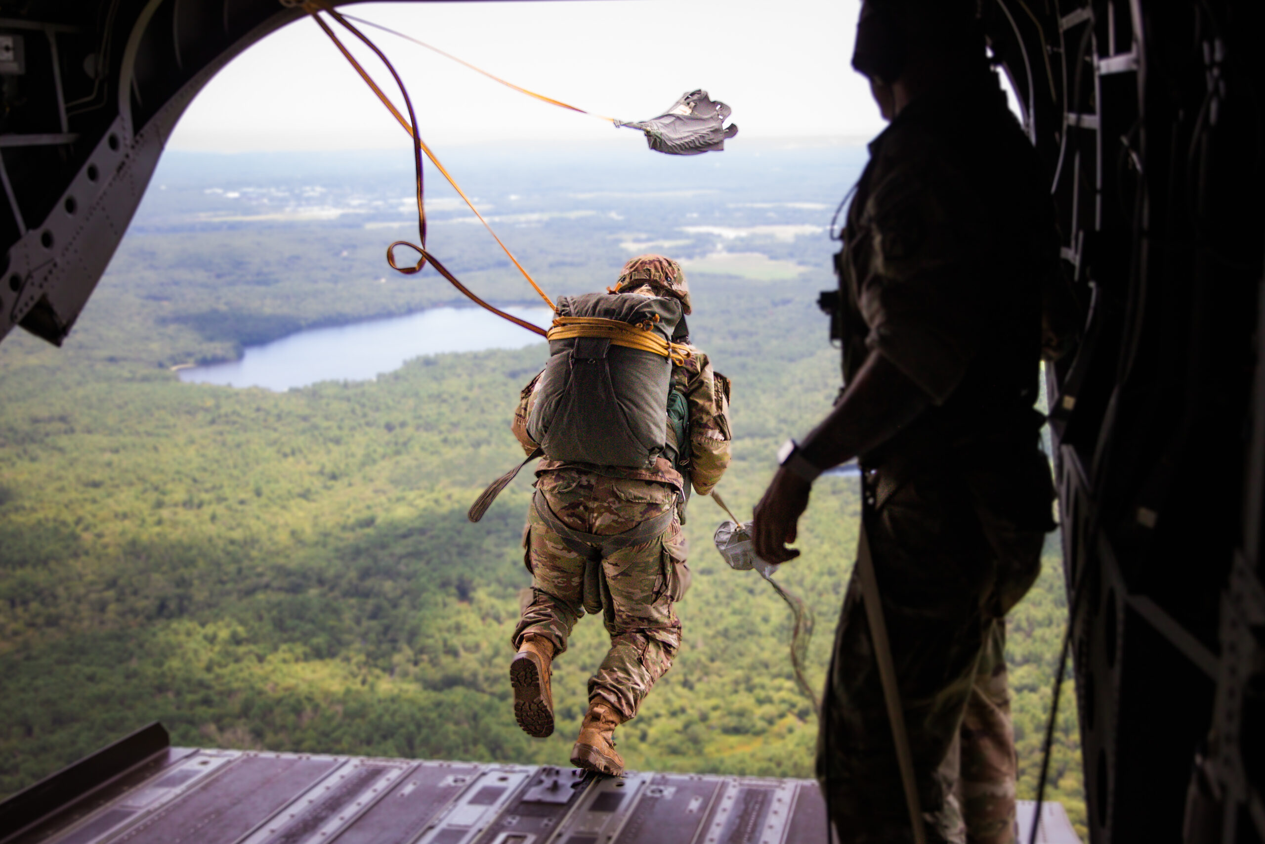 A group of US Army Paratroopers and International Paratroopers descend