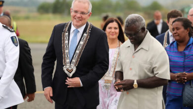 Former Australian Prime Minister Scott Morrison is greeted by Solomon Islands' PM Manasseh Sogavare during a trip to Honiara