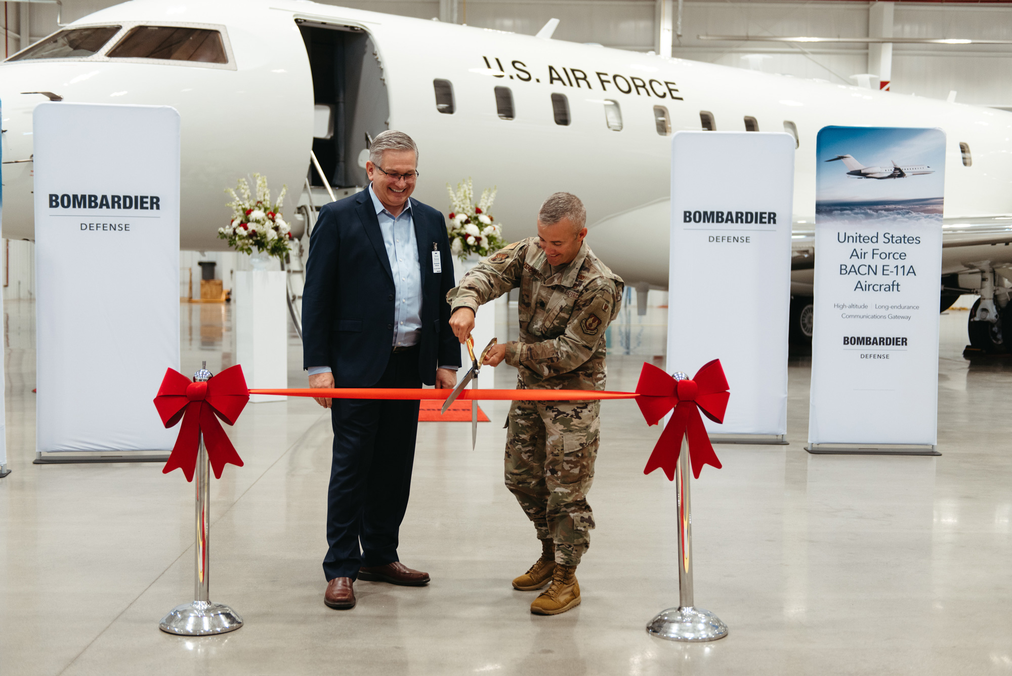 USAF, Bombardier cuts ribbon for new Global 6000 aircraft.