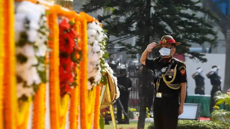 A file photo shows then-Commanding-in-Chief Eastern Command of Indian Army Lieutenant General Anil Chauhan salutes during a ceremony to mark “Vijay Diwas"