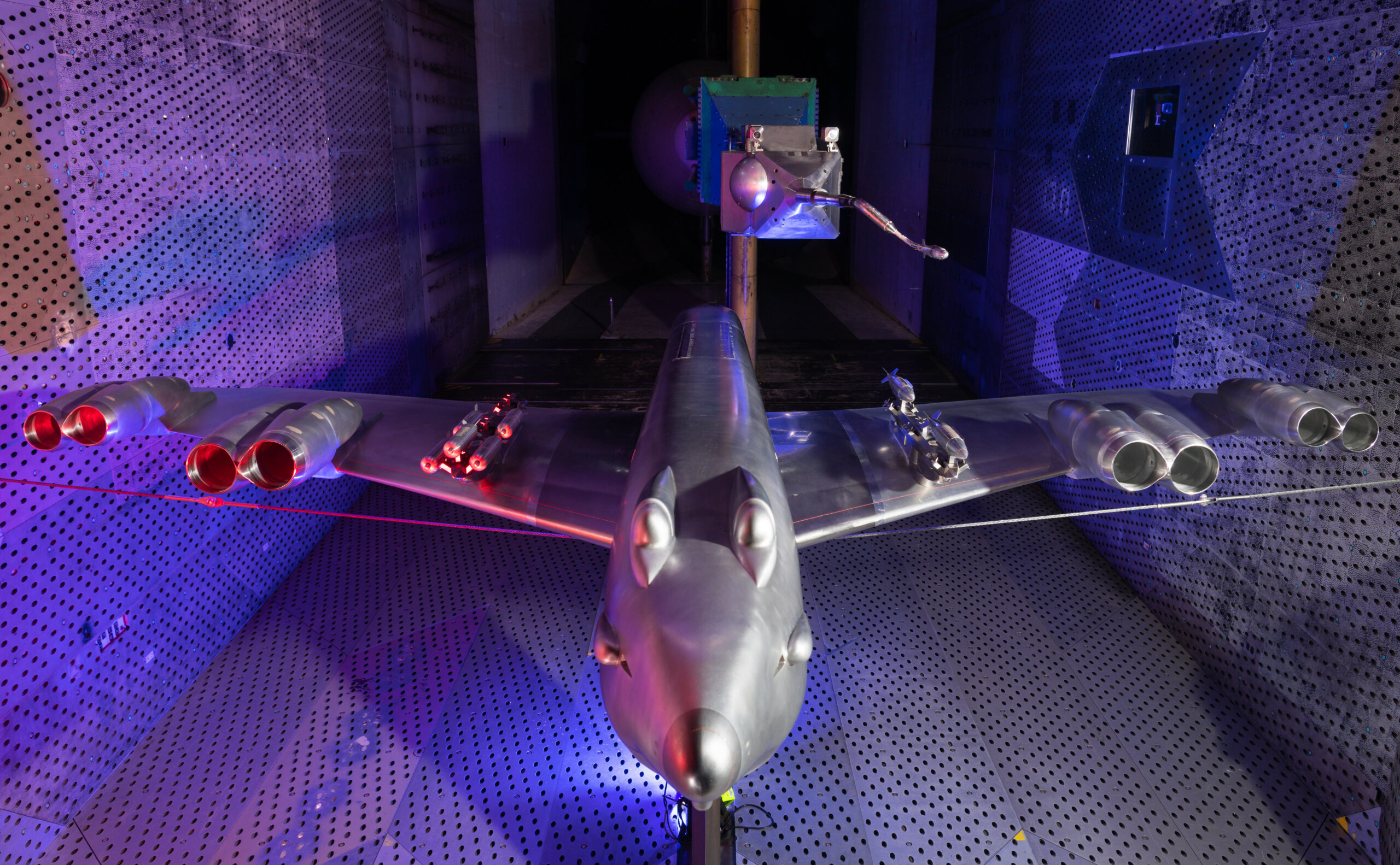 GBU-38 bomb mounted on B-52H Stratofortress model in a wind tunnel.
