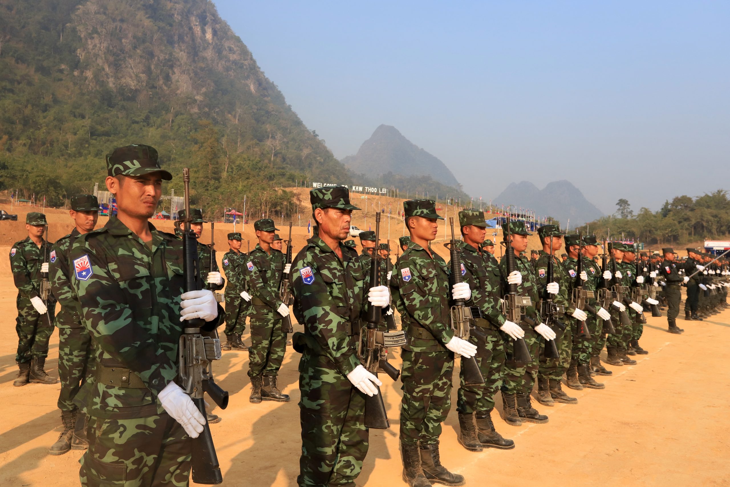 Karen National Liberation Army soldiers taking part in a parade for the 70th anniversary of the Karen revolution at a remote base