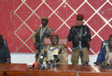 Burkina Faso's new self-proclaimed leader captain Ibrahim Traore, center, attends a meeting in Ouagadougou