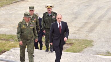 Russian President Vladimir Putin with army officials