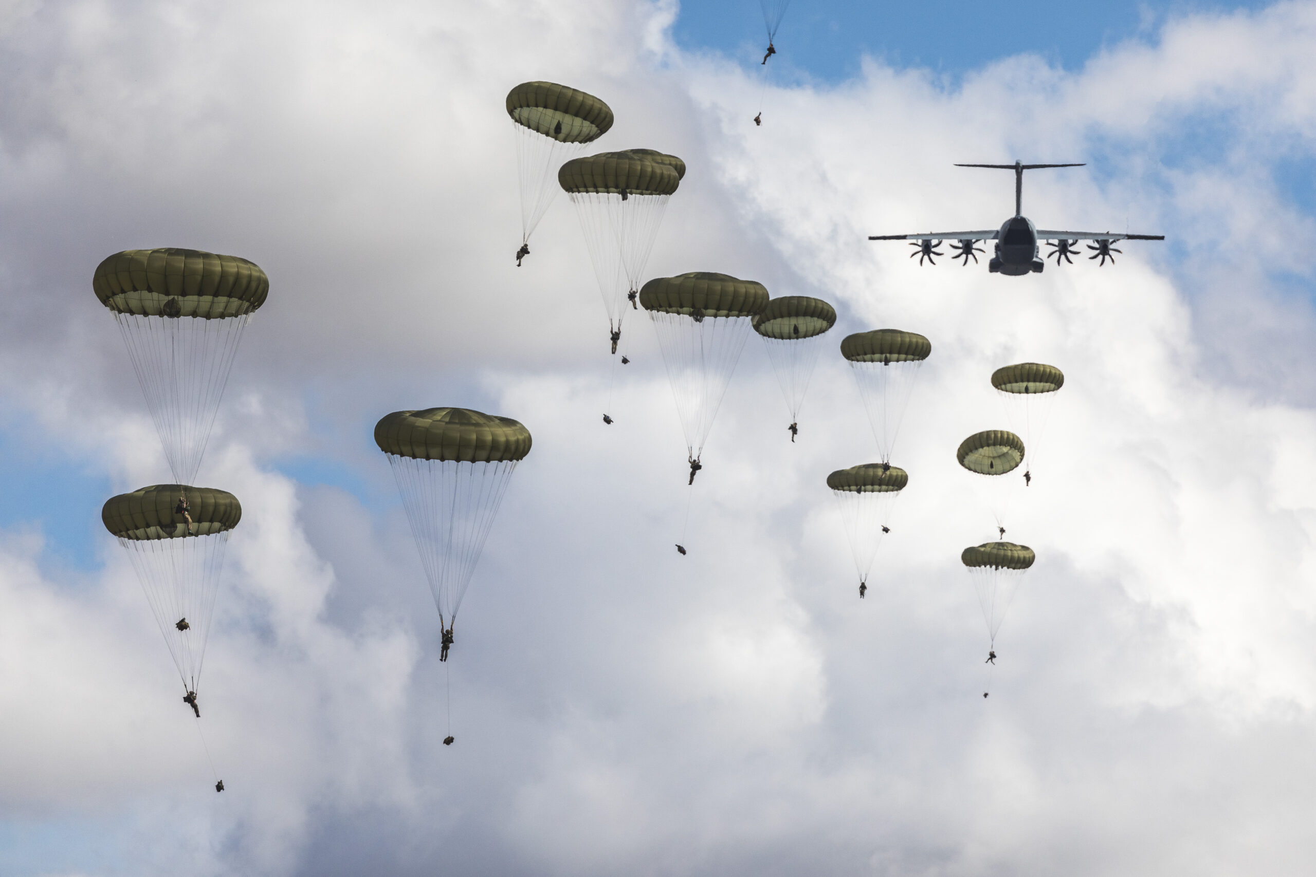 British Army paratroopers descending from A400M Atlas aircraft.