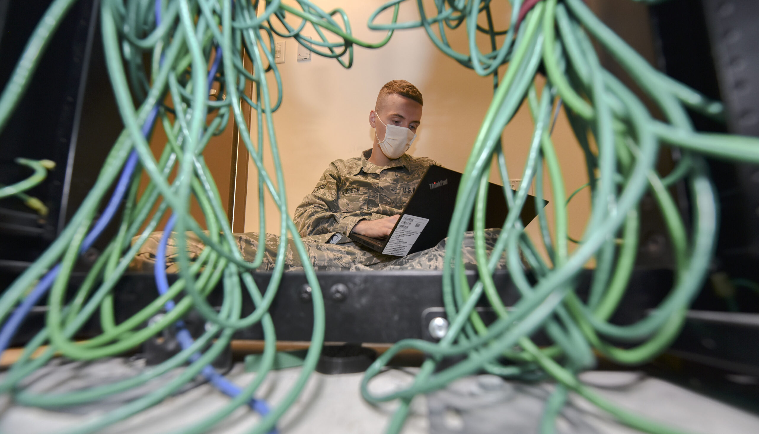 Network technician configures a network switch for customer connectivity.