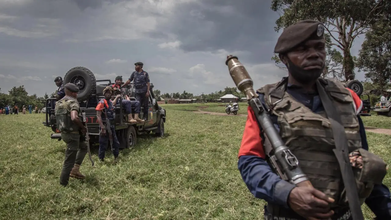 Soldiers of the Democratic Republic of Congo's armed forces perform a security patrol around the Kiwanja airfield days after clashes with the M23 rebels