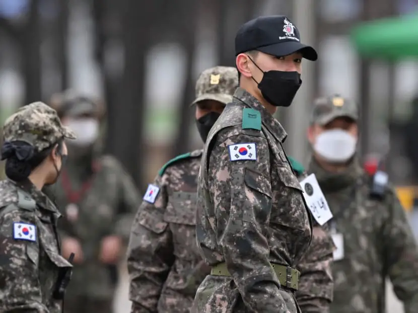 South Korean soldiers stand at the main gate of a military training unit in Yeoncheon