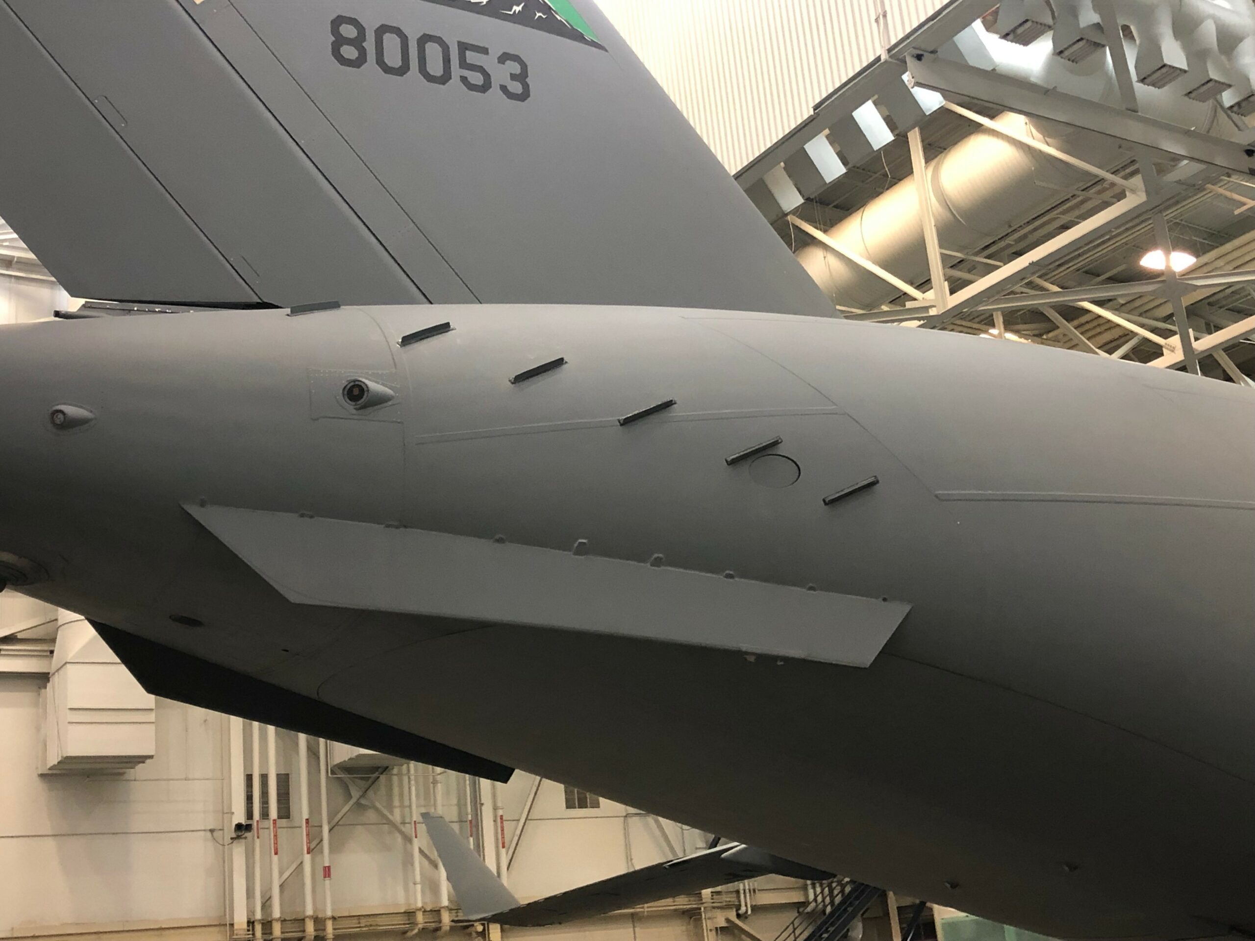 The drag reduction devices known as microvanes are shown on the aft-end of a C-17 Globemaster III