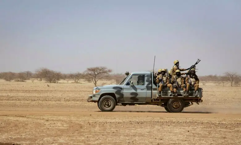Burkinabe soldiers aboard a military vehicle