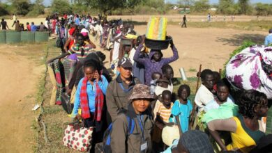 South Sudanese civilians line up outside a U.N. compound in Bor offering refuge and basic health necessities