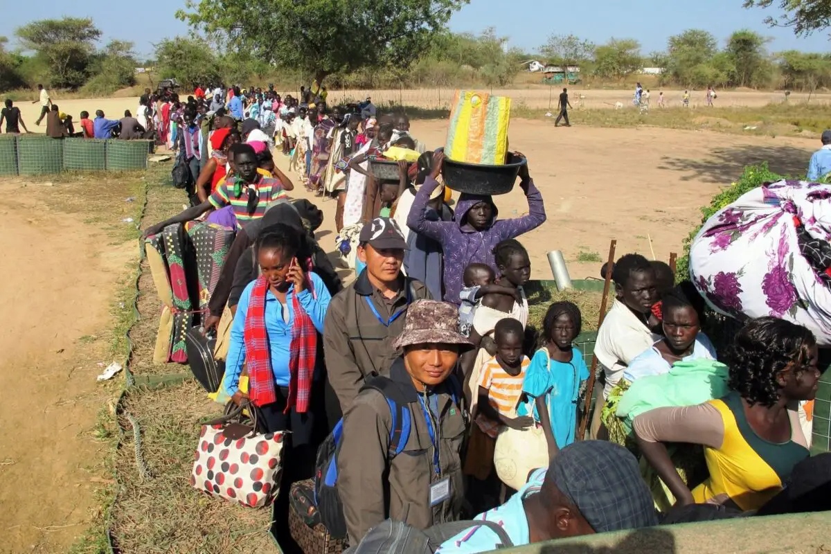 South Sudanese civilians line up outside a U.N. compound in Bor offering refuge and basic health necessities
