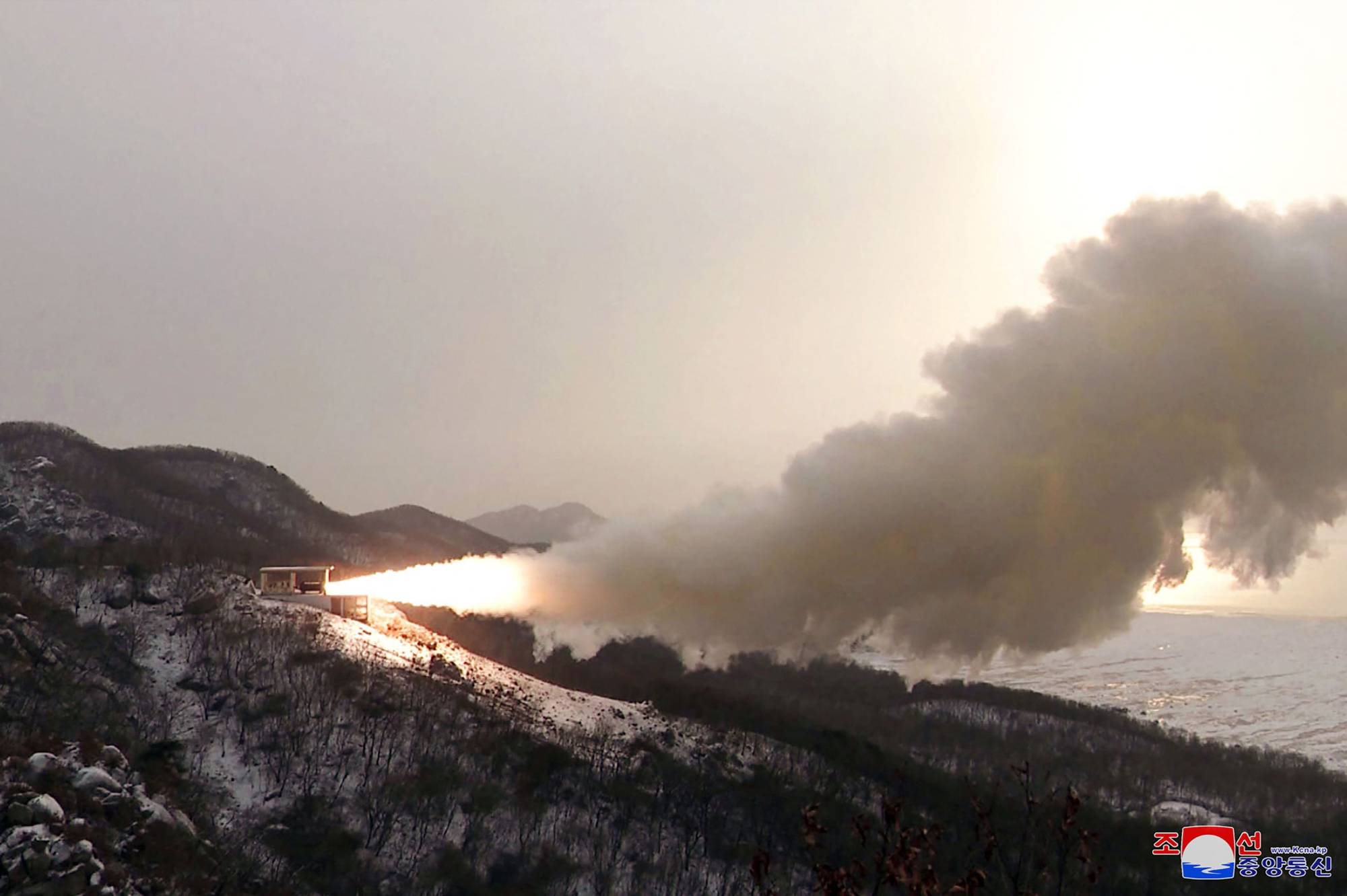 This picture taken on December 15, 2022 and released from North Korea's official Korean Central News Agency (KCNA) on December 16, 2022 shows a ground ejection test - a high-power solid fuel engine test - conducted at the Saikai satellite launch site in South Pyongan Province