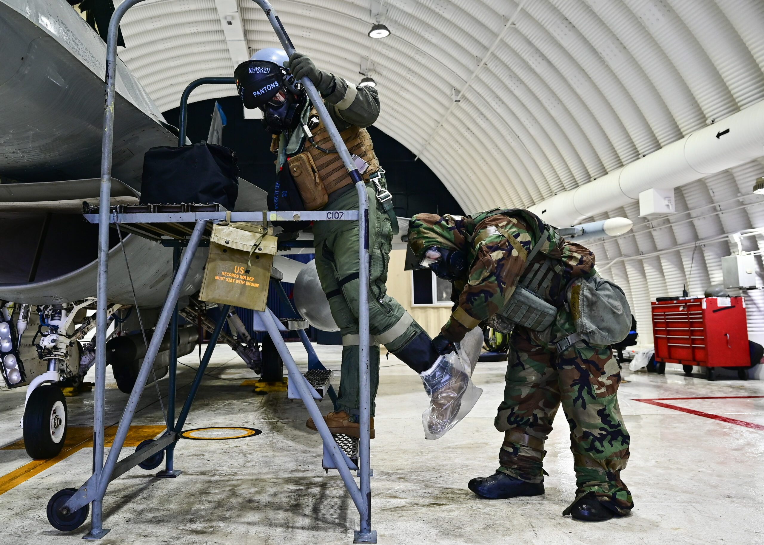 PACAF aircrew conducts CBRN over-cloak removal
