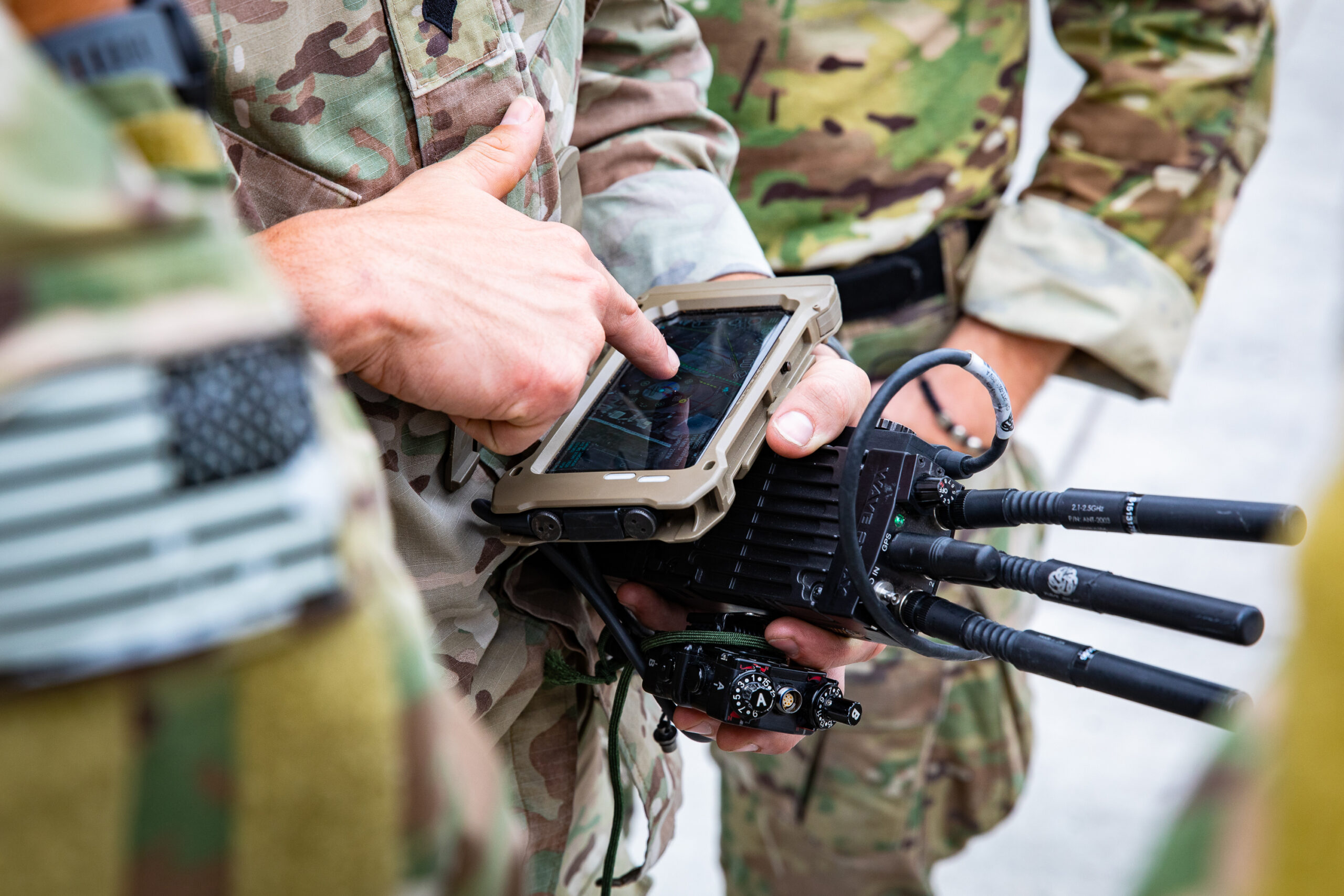 Soldiers from U.S. Army Special Operations Command train with devices connected via the Defense Advanced Research Projects Agency (DARPA) Secure Handhelds on Assured Resilient networks at the tactical Edge (SHARE) system in preparation for their employment during Project Convergence 22. PC22 is an All-Service and Multinational campaign of learning featuring experiments on hundreds of different technologies and capabilities. (U.S. Army photo by CPT Alex Werden)