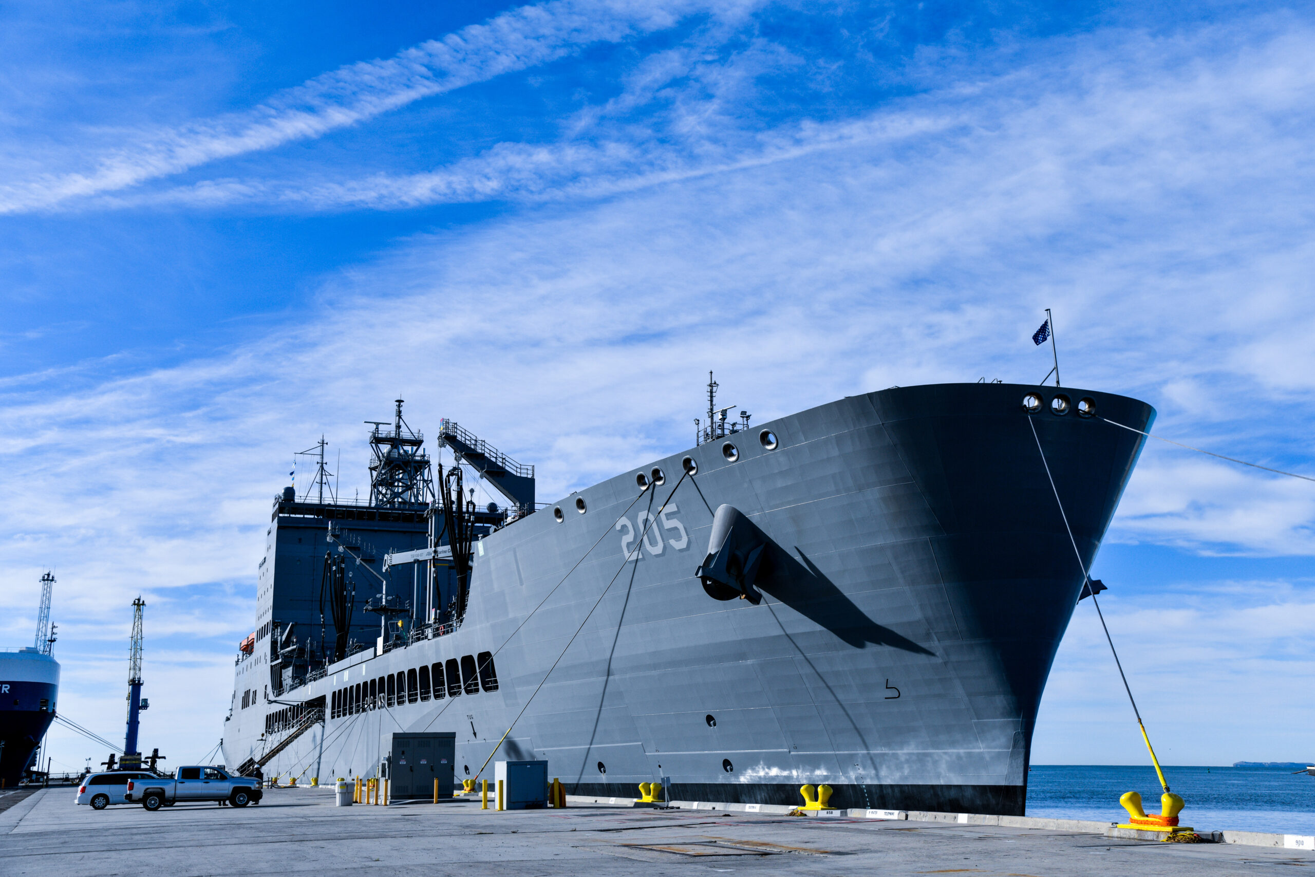 USNS John Lewis (T-AO 205) sits pierside at Naval Surface Warfare Center, Port Hueneme Division (NSWC PHD), Friday, Nov. 4. The U.S. Navy fleet replenishment oiler, delivered to Military Sealift Command in July, is in the beginning months of its year-long ship qualification trials schedule and stopped by NSWC PHD for a stores resupply and minor repairs by builder representatives. The Underway Replenishment (UNREP) fuel and cargo delivery stations aboard the civilian-crewed ship use the new Electric Standard Tensioned Replenishment Alongside Method (E-STREAM) technology, designed by NSWC PHD UNREP engineers. USNS John Lewis is the first oiler to have the new E-STREAM systems on board, and the command’s UNREP team members were excited to see in person the system installed on a ship. (U.S. Navy photo by Dana Rene White/Released)