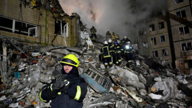 Rescuers work at the site of a Russian missile strike on an apartment building in the Ukrainian city of Dnipro