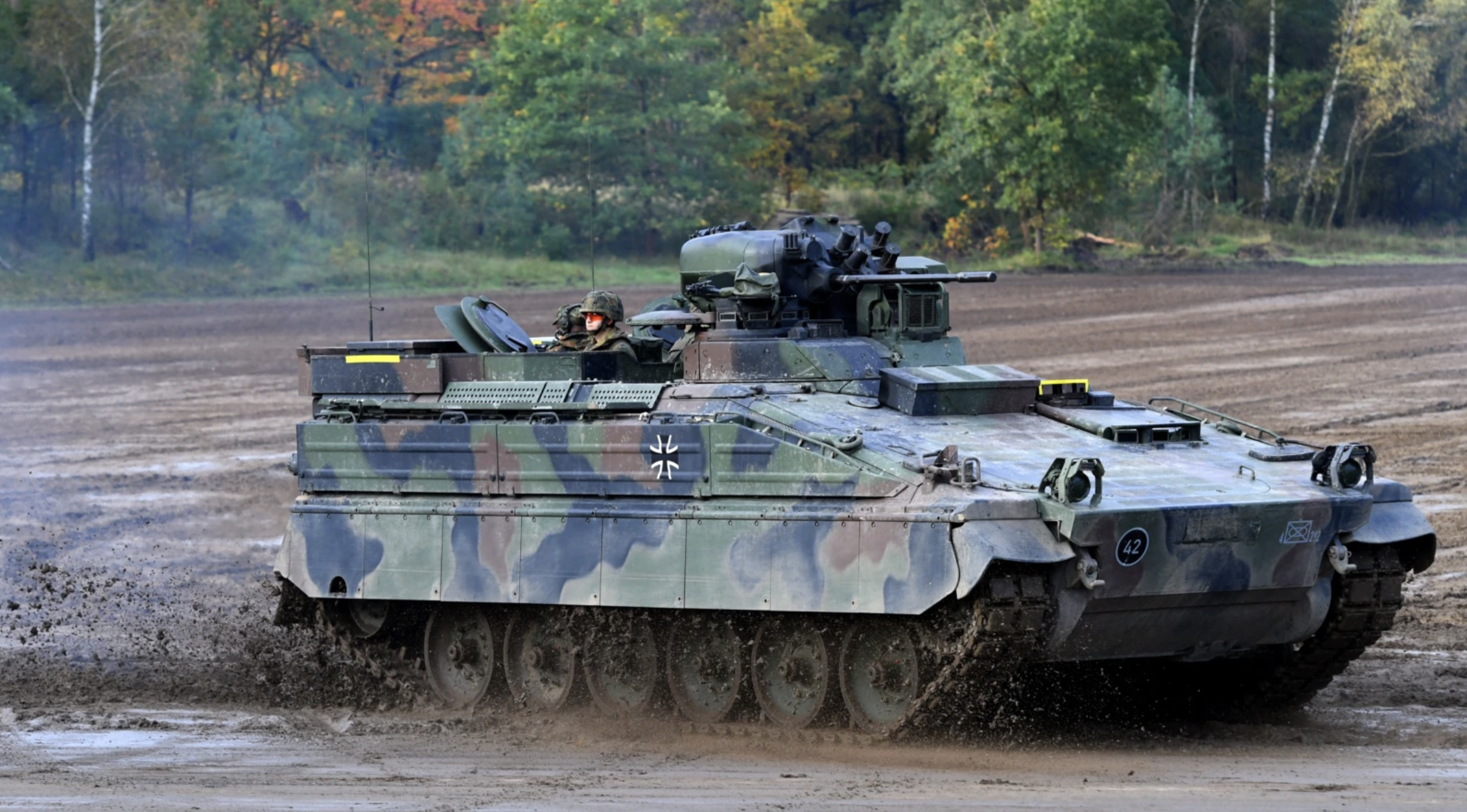 Marder infantry fighting vehicle of the German armed forces Bundeswehr drives through the mud
