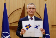 NATO Secretary-General Jens Stoltenberg holds application documents presented by Finland and Sweden