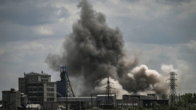 Smoke and debris ascend after a strike at a factory in the city of Soledar, in eastern Ukraine's Donbas region