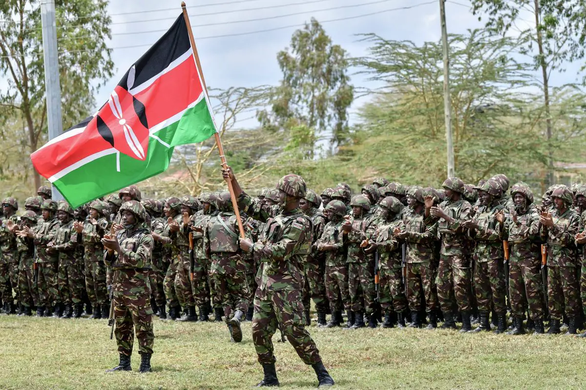Kenya Defense Forces soldiers attend a flag presentation ceremony