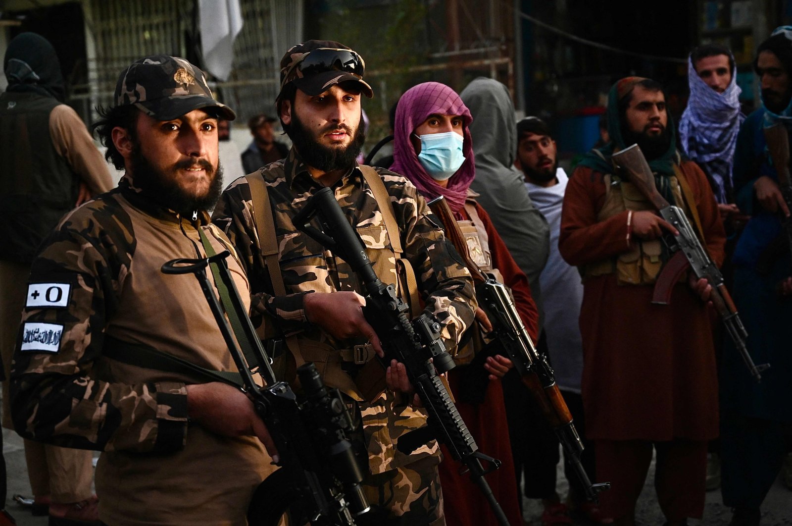 Taliban fighters stand guard near the military hospital in Kabul, Afghanistan
