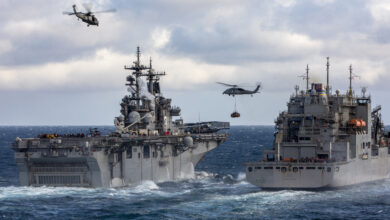 ATLANTIC OCEAN (April 25, 2022) HM-60 Seahawks attached to Helicopter Squadron Command 26 and Helicopter Squadron Command 22 fly packages from the Lewis and Clark-class dry cargo ship USNS Robert E. Peary (T-AKE-5), right, to the third Wasp-class amphibious assault ship USS Kearsarge (LHD-3), during a vertical replenishment, April 25, 2022. Gunston Hall, assigned to the Kearsarge Amphibious Ready Group, is on a scheduled deployment under the command and control of Task Force 61/2 while operating in U.S. sixth Fleet in support of U.S., Allied and partner interests in Europe and Africa. (U.S. Navy Photo by Mass Communication Specialist Seaman Keith Nowak)