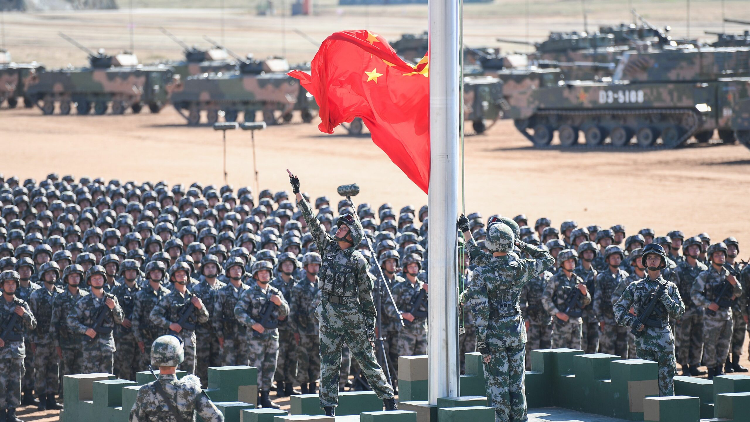 The Chinese flag is raised during a military parade at the Zhurihe training base