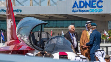 UAE Deputy Prime Minister Sheikh Mansour bin Zayed al-Nahyan (C) views advanced trainer at the Abu Dhabi International Exhibition Centre