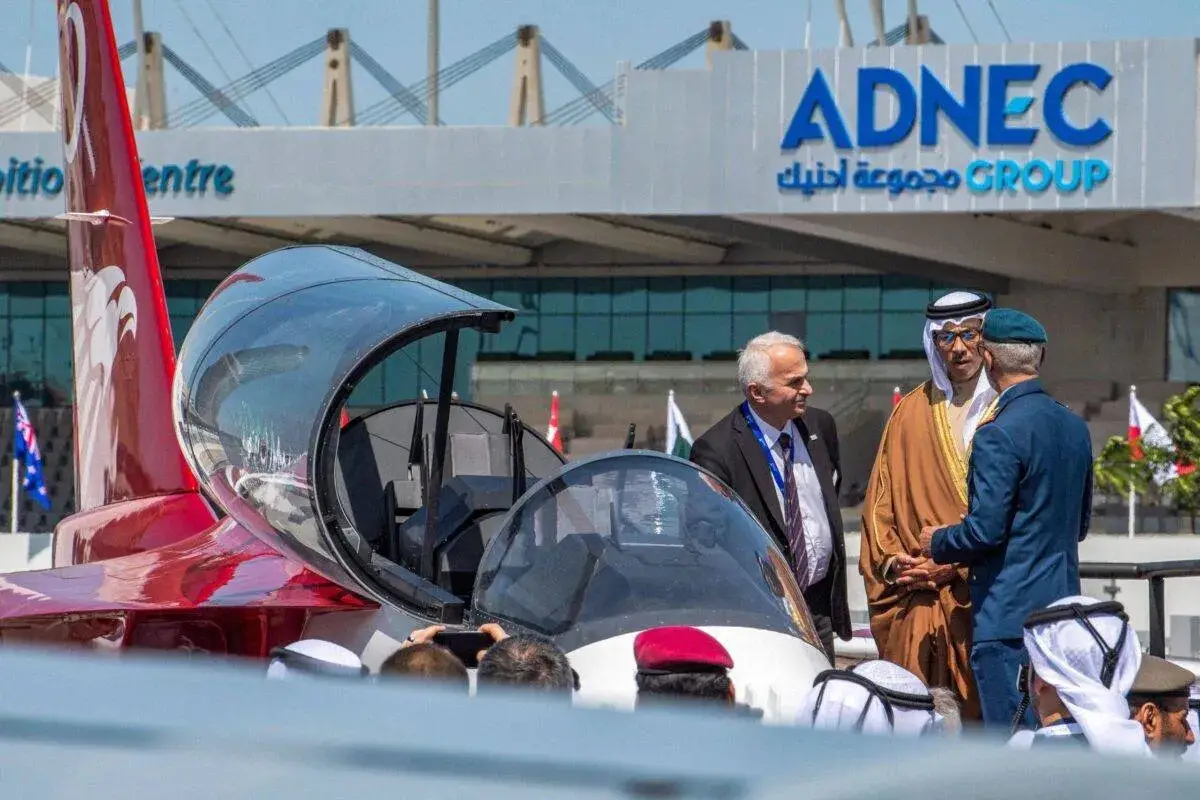 UAE Deputy Prime Minister Sheikh Mansour bin Zayed al-Nahyan (C) views advanced trainer at the Abu Dhabi International Exhibition Centre